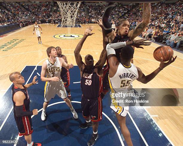 Roy Hibbert of the Indiana Pacers battles Michael Beasley and Joel Anthony of the Miami Heat at Conseco Fieldhouse on April 2, 2010 in Indianapolis,...