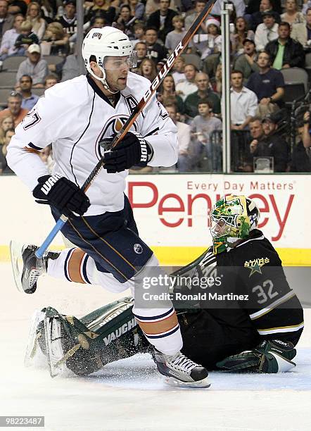 Right wing Dustin Penner of the Edmonton Oilers scores a goal against Kari Lehtonen of the Dallas Stars at American Airlines Center on April 2, 2010...