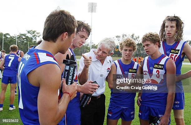 Alan McConnell, coach of the Greater Western Sydney talks with his team at quarter time during the round two TAC Cup match between Greater Western...