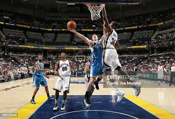 Hasheem Thabeet of the Memphis Grizzlies attempts to block the shot of Darius Songaila of the New Orleans Hornets on April 02, 2010 at FedExForum in...