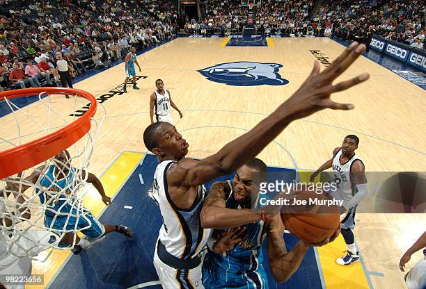 Hasheem Thabeet of the Memphis Grizzlies attempts to block the shot of Marcus Thornton of the New Orleans Hornets on April 02, 2010 at FedExForum in...