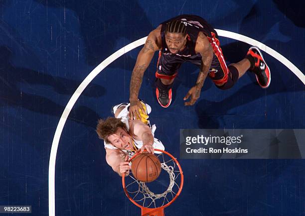 Troy Murphy of the Indiana Pacers jams over Udonis Haslem of the Miami Heat at Conseco Fieldhouse on April 2, 2010 in Indianapolis, Indiana. NOTE TO...