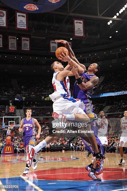 Austin Daye of the Detroit Pistons goes up for a shot attempt against Channing Frye of the Phoenix Suns in a game at the Palace of Auburn Hills on...
