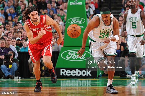 Paul Pierce of the Boston Celtics chases after the loose ball against Luis Scola of the Houston Rockets on April 2, 2010 at the TD Garden in Boston,...