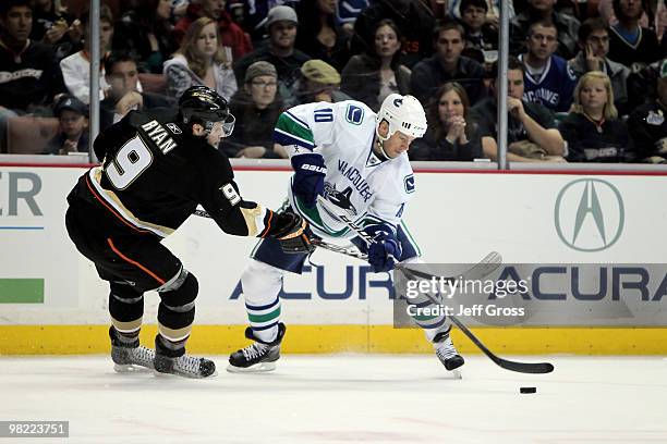 Ryan Johnson of the Vancouver Canucks and Bobby Ryan of the Anaheim Ducks battle for the puck in the first period at the Honda Center on April 2,...