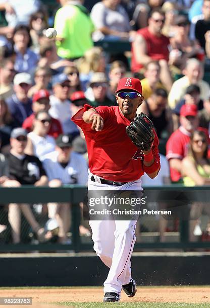 Infielder Maicer Izturis of the Los Angeles Angels of Anaheim fields a ground ball out against the Chicago White Sox during the MLB spring training...