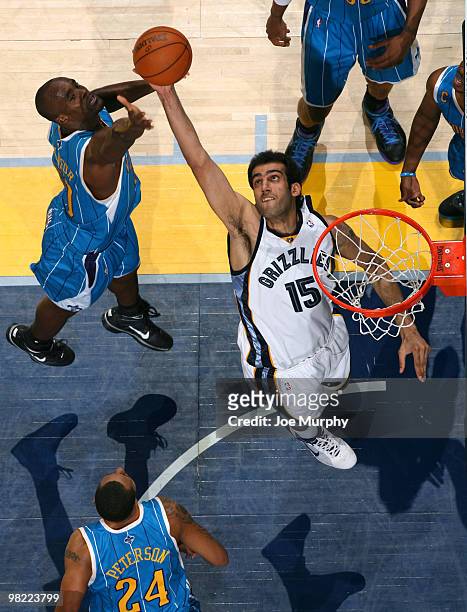 Hamed Haddadi of the Memphis Grizzlies grabs a rebound against Emeka Okafor of the New Orleans Hornets on April 02, 2010 at FedExForum in Memphis,...