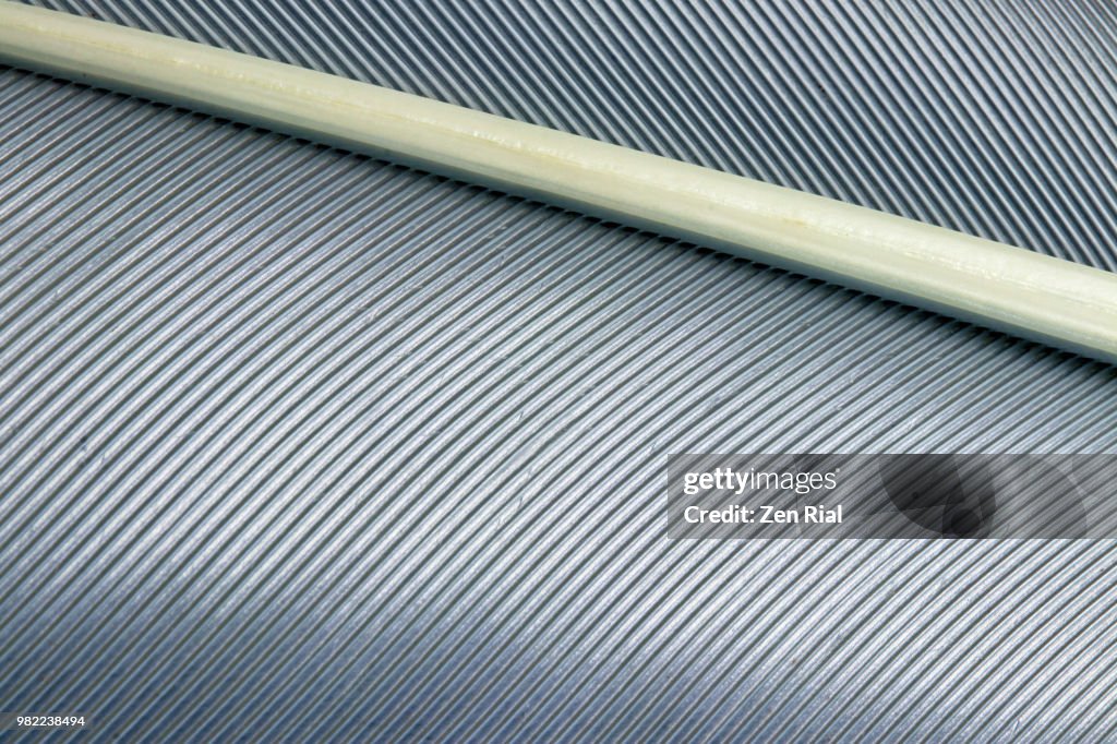 Extreme close-up of a gray bird feather
