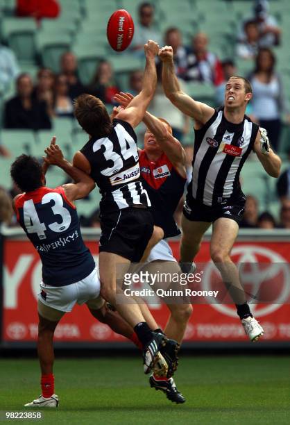 Nick Maxwell of the Magpies punches the ball during the round two AFL match between the Collingwood Magpies and the Melbourne Demons at the Melbourne...