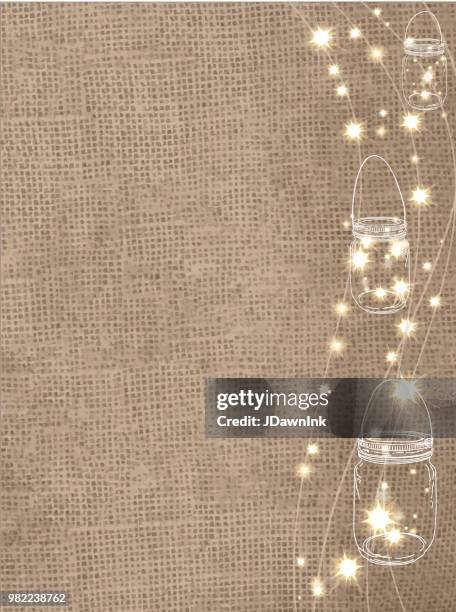 rustic burlap background with string lights and canning jars with sparks - hessian background stock illustrations