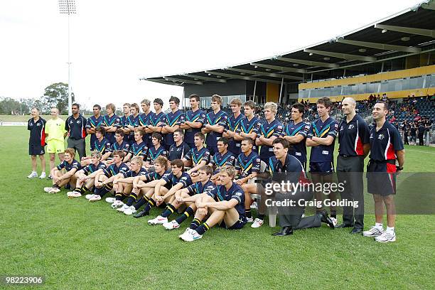 Players from the AIS AFL Academy Squad pose for a team photo before the start of the trial match between the AIS AFL Academy Squad and the Sydney...