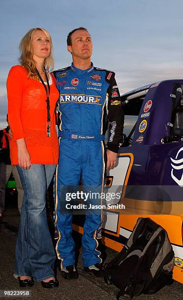 Kevin Harvick, driver of the Charter Chevrolet stands on the grid with wife Delana, during the NASCAR Camping World Truck Series Nashville 200 at...