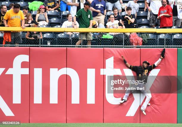 Starling Marte of the Pittsburgh Pirates cannot make a catch on a ball off the bat of Chris Owings of the Arizona Diamondbacks in the third inning...