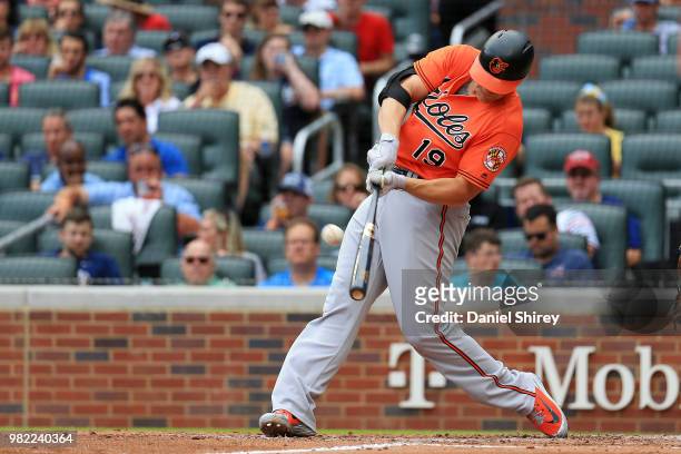 Chris Davis of the Baltimore Orioles hits a three RBI double during the fifth inning against the Atlanta Braves at SunTrust Park on June 23, 2018 in...