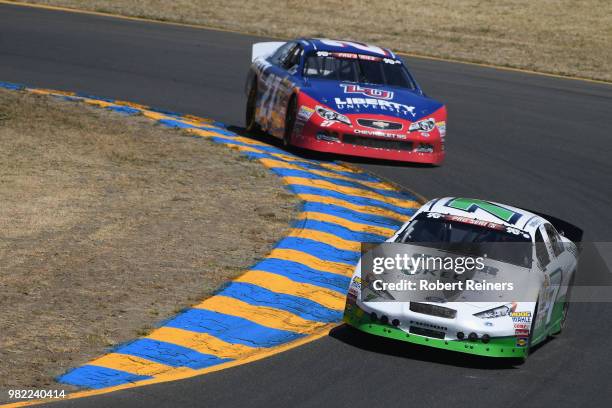 Will Rodgers, driver of the Kelly & Associates Insurance Group Ford, leads William Byron, driver of the Liberty Chevrolet, during the NASCAR K&N Pro...