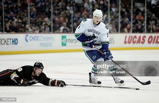 Bobby Ryan of the Anaheim Ducks attempts to knock the puck away from Christian Erhoff of the Vancouver Canucks in the second period at the Honda...