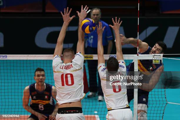 Filippo Lanza attacks Kevin Le Roux and Benjamin Toniutti during the FIVB Volleyball Nations League 2018 between Italy and France at Palasport Panini...