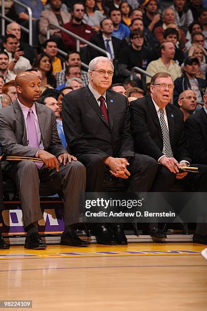 Head coach Phil Jackson of the Los Angeles Lakers sits between assistant coaches Brian Shaw and Frank Hamblen during a game against the Utah Jazz at...