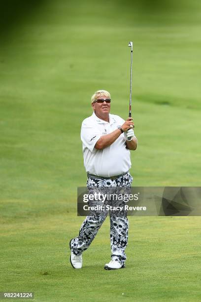 John Daly hits his second shot on the 18th hole during the second round of the American Family Insurance Championship at University Ridge Golf Course...