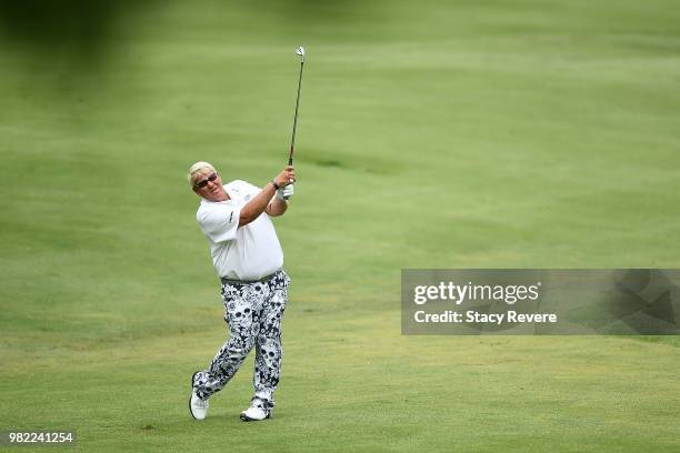 John Daly hits his second shot on the 18th hole during the second round of the American Family Insurance Championship at University Ridge Golf Course...