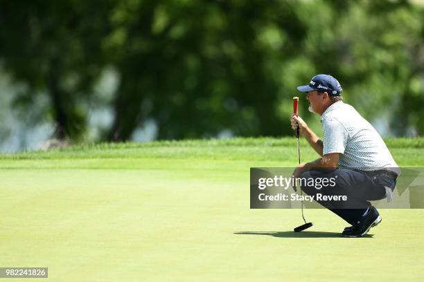 Jerry Kelly lines up a putt on the sixth green during the second round of the American Family Insurance Championship at University Ridge Golf Course...