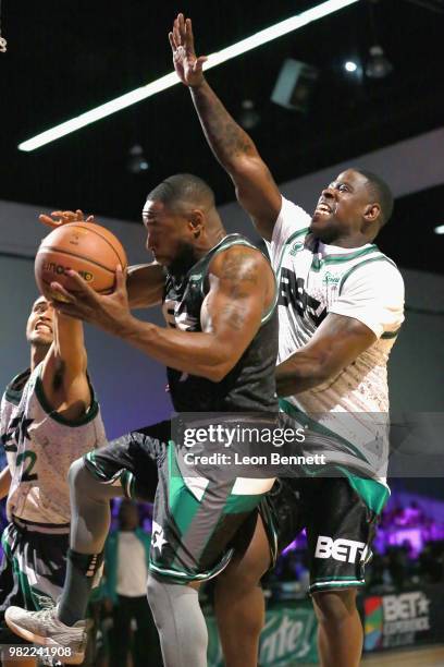 Kap G, Tank, and Casanova play basketball at the Celebrity Basketball Game Sponsored By Sprite during the 2018 BET Experience at Los Angeles...