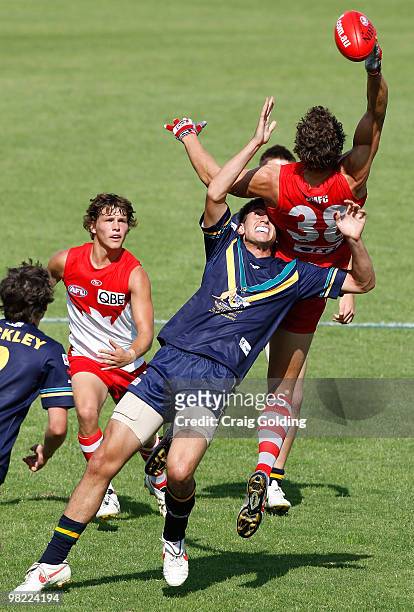 Mike Pyke of the Swans and Billy Longer of the AIS during the trial match between the AIS AFL Academy Squad and the Sydney Swans Reserves at...