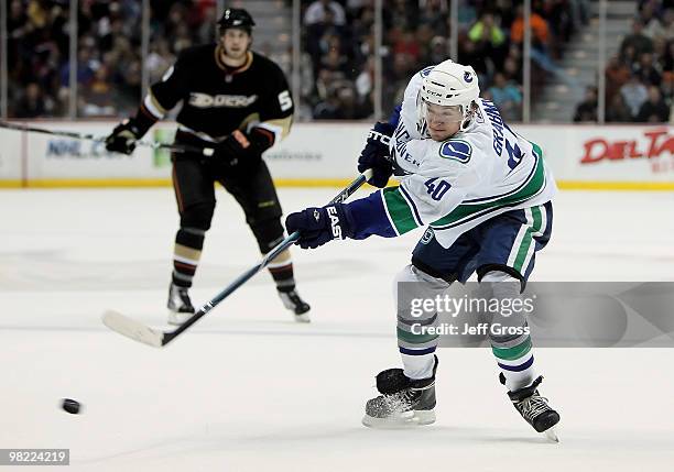 Michael Grabner of the Vancouver Canucks shoots the puck in the second period against the Anaheim Ducks at the Honda Center on April 2, 2010 in...