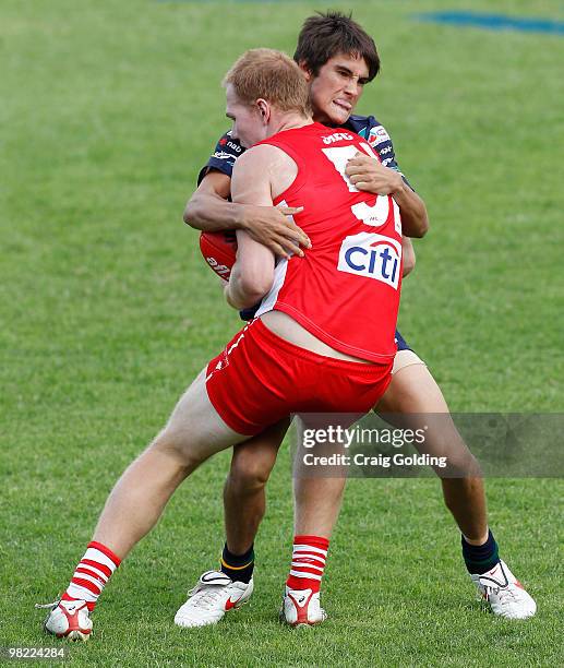 Chad Wingard of the AIS passes makes a tackle during the trial match between the AIS AFL Academy Squad and the Sydney Swans Reserves at Blacktown...