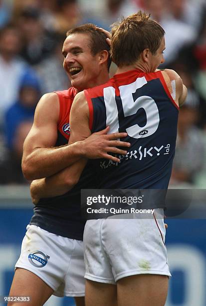 Brad Green and Ricky Petterd of the Demons celebrate a goal during the round two AFL match between the Collingwood Magpies and the Melbourne Demons...