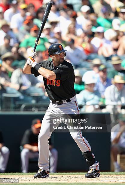 Mark DeRosa of the San Francisco Giants at bat during the MLB spring training game against the Oakland Athletics at Phoenix Municipal Stadium on...