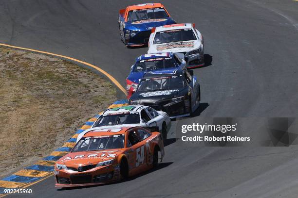 Daniel Suarez, driver of the Seth Smith Arris, leads Will Rodgers, driver of the Kelly & Associates Insurance Group Ford, during the NASCAR K&N Pro...