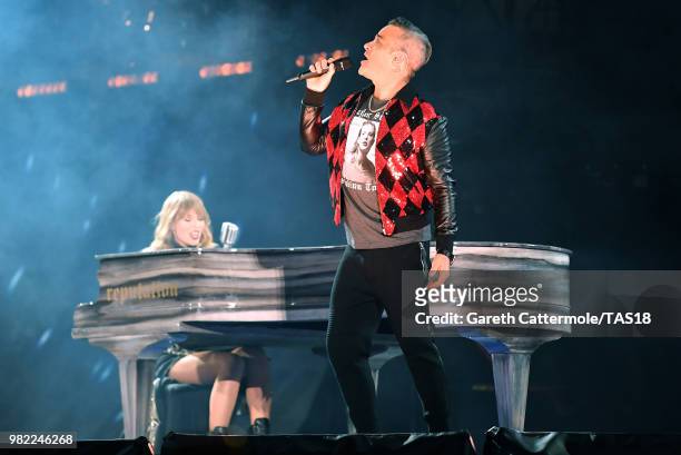 Taylor Swift and Robbie Williams perform on stage during the reputation Stadium Tour at Wembley Stadium on June 23, 2018 in London, England.