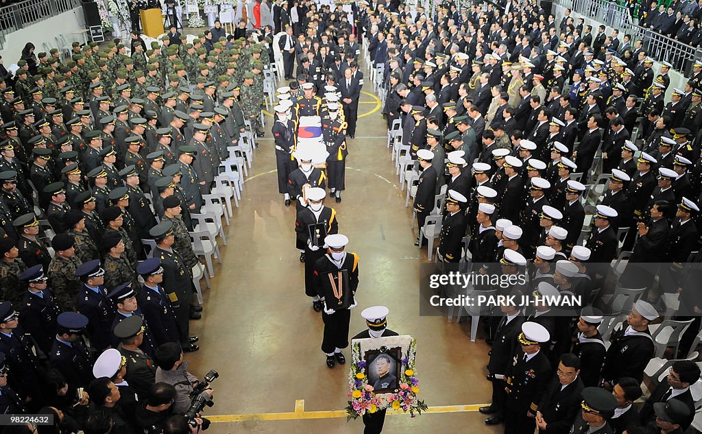 South Korean Navy honor guard carry the