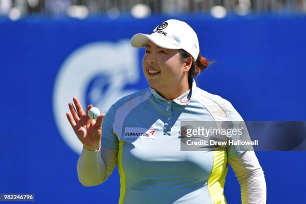 Shanshan Feng of China waves her ball to the crowd on the 17th hole during the second round of the Walmart NW Arkansas Championship Presented by P&G...