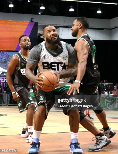 Travis Greene, The Game, and Christian Keyes play basketball at the Celebrity Basketball Game Sponsored By Sprite during the 2018 BET Experience at...