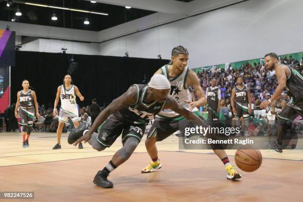 Larry 'Bone Collector' Williams and Kap G play basketball at the Celebrity Basketball Game Sponsored By Sprite during the 2018 BET Experience at Los...