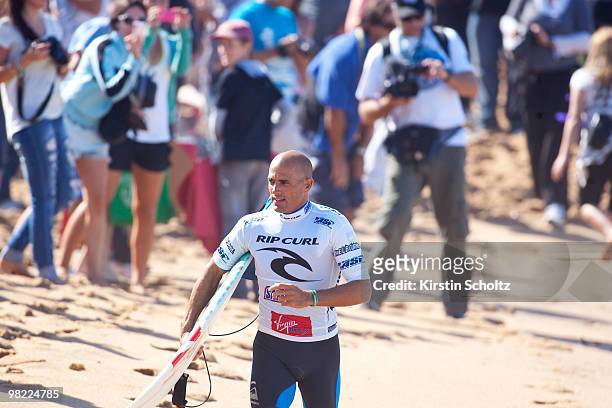 Kelly Slater of the United States of America runs up the beach for his round 1 heat at the Rip Curl Pro on April 3, 2010 in Bells Beach, Australia.