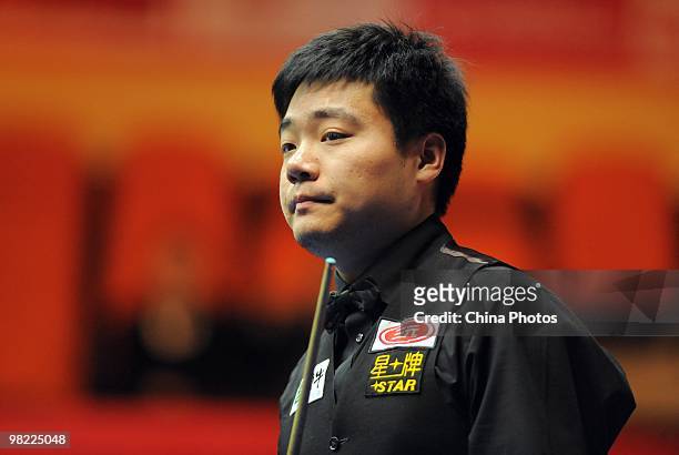 Ding Junhui of China looks on during his quarterfinal match against Peter Ebdon of England during the 5th day of 2010 World Snooker China Open at...