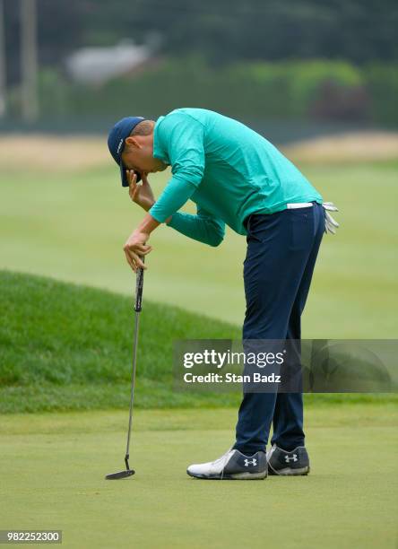 Jordan Spieth reacts to his putt on the seventh hole during the third round of the Travelers Championship at TPC River Highlands on June 23, 2018 in...