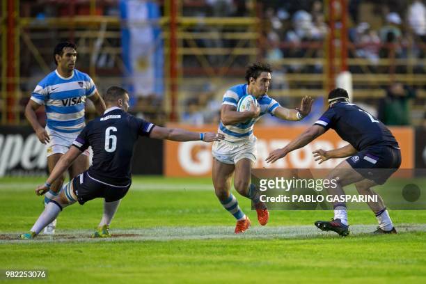 Bautista Ezcurra from Argentina runs with the ball, during their international test match against Scotland, at the Centenario stadium, in...