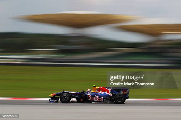 Mark Webber of Australia and Red Bull Racing drives during the final practice session prior to qualifying for the Malaysian Formula One Grand Prix at...