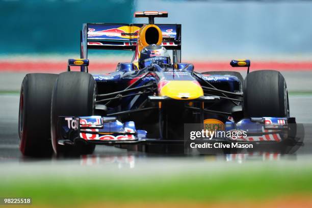 Sebastian Vettel of Germany and Red Bull Racing drives during the final practice session prior to qualifying for the Malaysian Formula One Grand Prix...