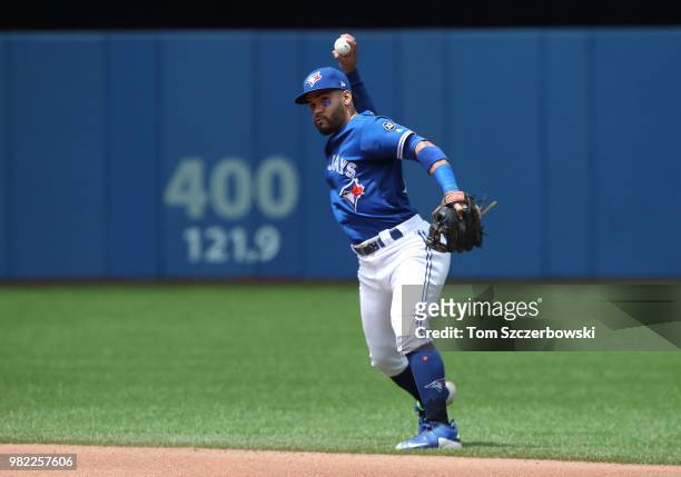 Devon Travis of the Toronto Blue Jays makes the play and throws out the baserunner in the seventh inning during MLB game action against the Atlanta...