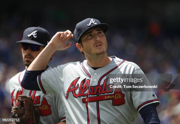 Luke Jackson of the Atlanta Braves walks off the mound and to his dugout after getting the final out of the eighth inning during MLB game action...