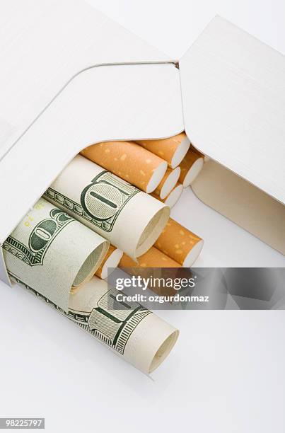 smoking cost - ozgurdonmaz stock pictures, royalty-free photos & images