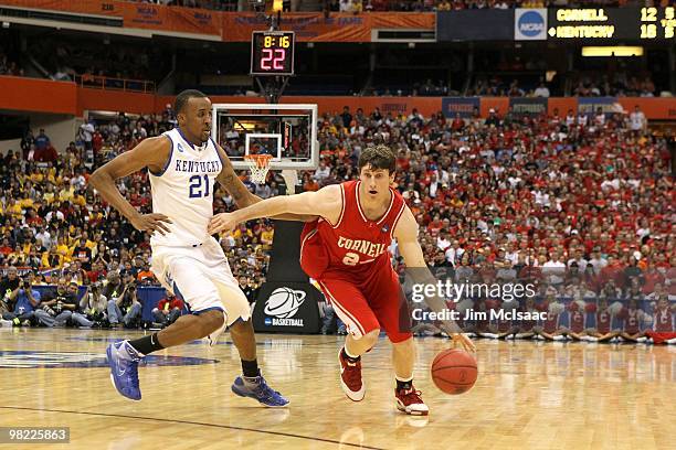 Adam Wire of the Cornell Big Red drives against Perry Stevenson of the Kentucky Wildcats uring the east regional semifinal of the 2010 NCAA men's...