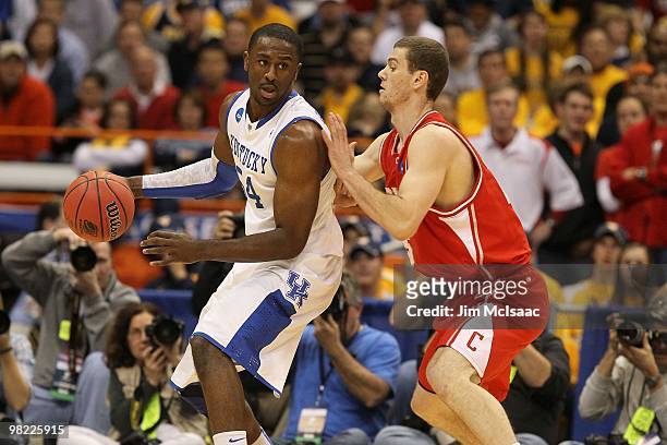 Patrick Patterson of the Kentucky Wildcats posts up against against Jon Jaques of the Cornell Big Red during the east regional semifinal of the 2010...
