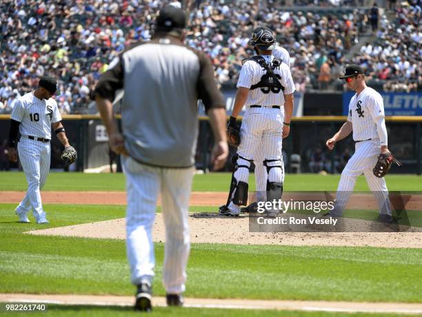 Pitching coach Don Cooper of the Chicago White Sox walks toward the pitchers mound to talk to Lucas Giolito during the game against the Detroit...