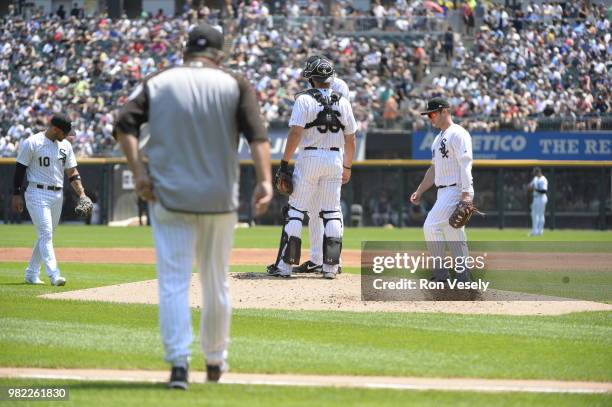 Pitching coach Don Cooper of the Chicago White Sox walks toward the pitchers mound to talk to Lucas Giolito during the game against the Detroit...